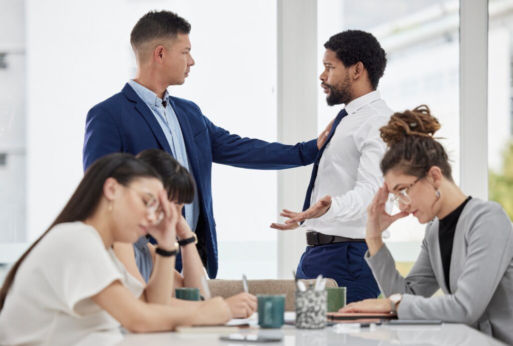 Meeting, frustrated and business people with problem in office with conflict, crisis and stressed.